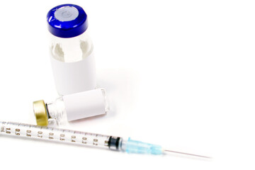Closeup and crop Injectable medications in sealed vials and a disposable plastic medical syringe isolate on white backgroundhite background