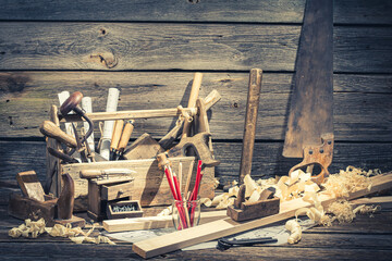 Old carpentry workbench and drawing workshop in rustic wooden shed