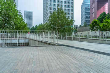 Fototapeta na wymiar modern buildings and empty pavement in china.