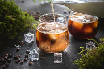 Iced coffee in a glass with cream
