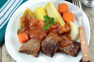 plate of pot au feu (french cuisine) on a table