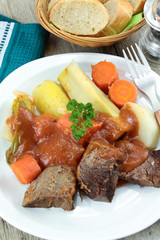 plate of pot au feu (french cuisine) on a table