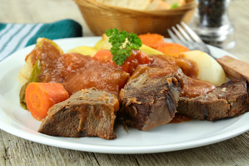 plate of pot au feu (french cuisine) on a table