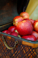  red apples in a vintage basket
