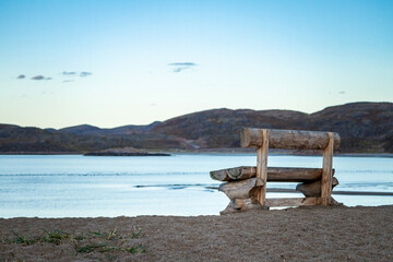 Teriberka. Bench on the coast of the Arctic Ocean. Russia.