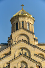 Fototapeta premium Around view of The Holy Trinity Cathedral of Tbilisi (Sameba) and buildings in old Tbilisi