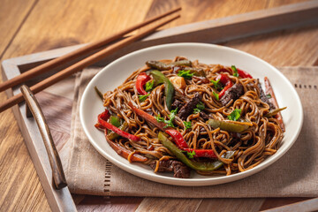 Soba noodles with vegetables and beef, asian style cuisine.