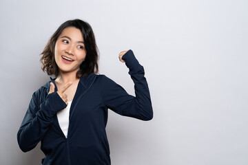 Portrait of a healthy woman present the copy space isolated over white background
