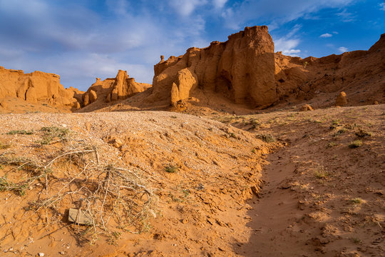 The orange rocks of Bayan Zag, commonly known as the Flaming Cliffs in the Gobi desert, Mongolia where important dinosaur fossils were found, Mongolia, Mongolian, Asia, Asian.
