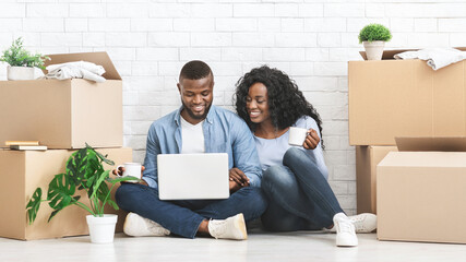 Positive man and woman purchasing furniture for new apartment