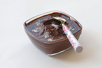 Supangle (pudding) dessert in glass bowl, on white background.