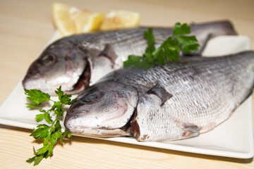 fresh fish with lemon and parsley