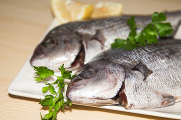 fresh fish with lemon and parsley