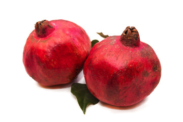 winter fruit, red pomegranate isolated on white