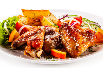 Roast chicken wings with baked potatoes