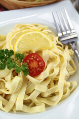 fresh tagliatelle butter on a plate