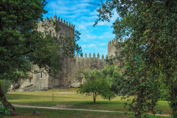 Fototapeta na wymiar Guimaraes, PORTUGAL - AUGUST 12, 2019: Castle of Guimaraes