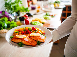 Grilled salmon with pepper on white plate