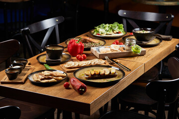 Assorted food set on wooden table. Luxury restaurant food
