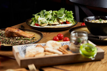 Assorted food set on wooden table. Luxury restaurant food