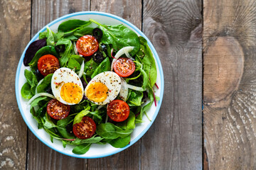 Salad with boiled egg and vegetables
