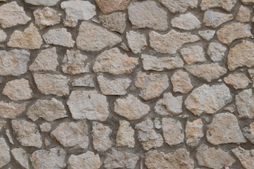 Stone and cement wall background, light brown color