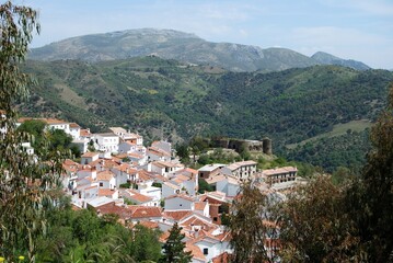 Fototapeta na wymiar View over village rooftops towards the mountains, Benadalid, Spain.