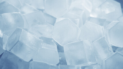 Macro shot of ice cubes from clear water that melt in slow motion on a white background. Concept:...