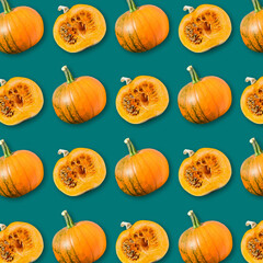 Geometric arrangement of ripe orange pumpkins on dark green background, colorful vegetable texture, vegan food pattern, autumn Halloween background 