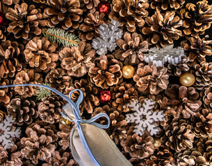 Winter holidays. Fir branches with gifts and flakes