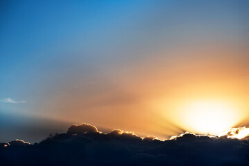 Blue sky with clouds and sunrise.