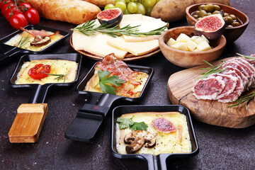 Delicious traditional Swiss melted raclette cheese on diced boiled or baked potato.