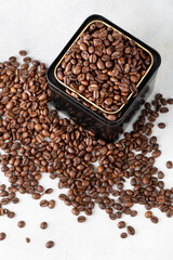 Coffee in metal jar on white background top view