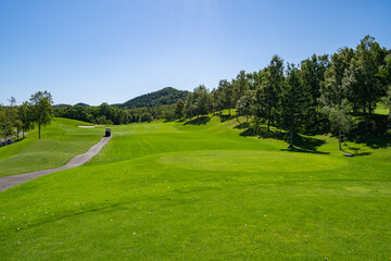 View of Golf Course with teeing area. Golf course with a rich green turf beautiful scenery.