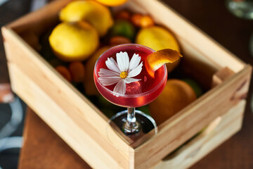 A glass of red cocktail.