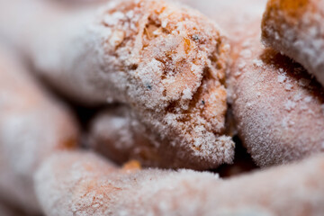 Frozen hungarian home made sausage with paprika powder close up macro shot.