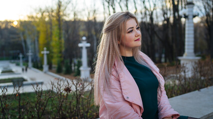 A portrait of a beautiful girl, walking in the autumn park.