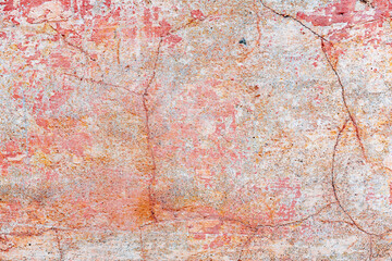 Texture of a concrete wall with cracks and scratches which can be used as a background