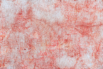 Texture of a concrete wall with cracks and scratches which can be used as a background