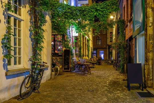 Old street of the historic city center of Antwerpen (Antwerp), Belgium. Night cityscape of Antwerp. Architecture and landmark of Antwerpen