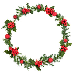 Fototapeta na wymiar Christmas winter & new year juniper fir wreath with red baubles & loose red holly berries on white background with copy space. Traditional symbol for the festive season. Flat lay.