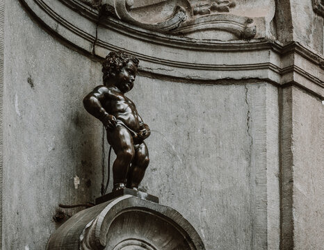 Manneken Pis (Little Pisser) is bronze sculpture in the centre of Brussels, Belgium. Manneken Pis is the best-known symbol of the people of Brussels