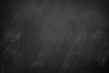 Abstract texture of chalk rubbed out on blackboard or chalkboard background, can be use as concept for school education, dark wall backdrop , design template , etc. © tonstock