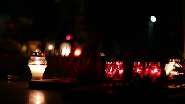 Close-Up Of Candles Burning At A Cemetery During All Saints Day.