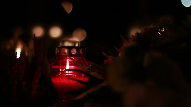 Close-Up Of Candles Burning At A Cemetery During All Saints Day.