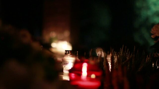 Close-Up Of Candles Burning At A Cemetery During All Saints Day.