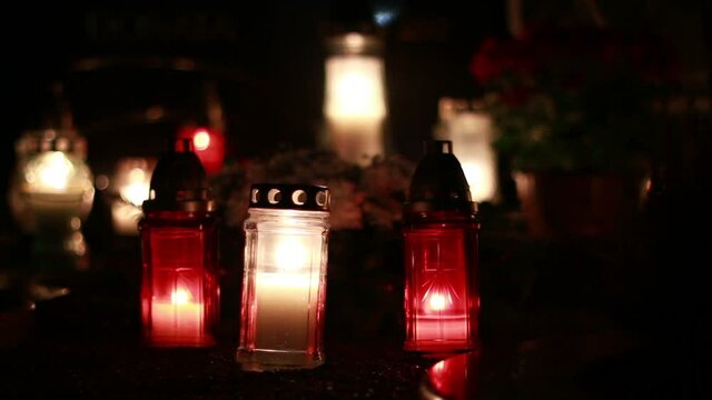Close-Up Of Candles Burning At A Cemetery During All Saints Day.