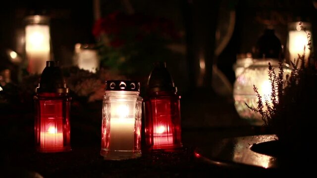Close-Up Of Candles Burning At A Cemetery During All Saints Day.