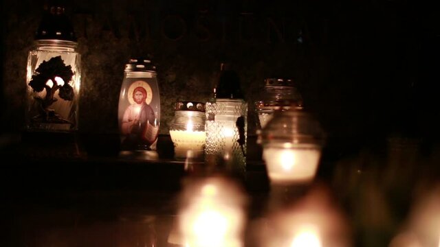 Close-Up Of Candles Burning At A Cemetery During All Saints Day.