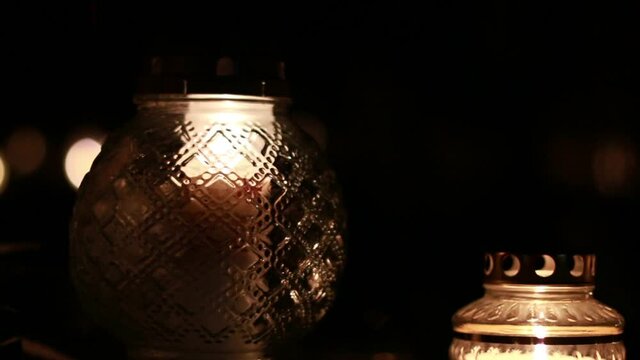 Close-Up Of Candles Burning At A Cemetery During All Saints Day.